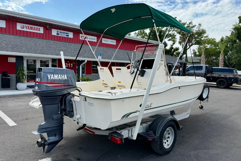 Slide: The Image of 2001 Scout 172 Sportfish boat with Yamaha motor on trailer, parked outside dealership. - 5