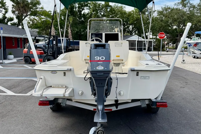 Slide: The Image of 2001 Scout 172 Sportfish boat with Yamaha 90 outboard motor, parked on trailer. - 6