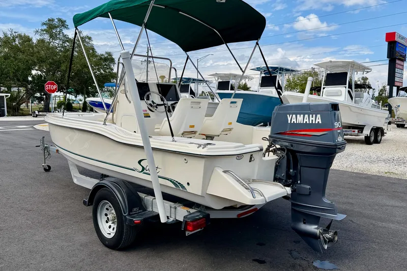 Slide: The Image of 2001 Scout 172 Sportfish boat with Yamaha 90 outboard motor on trailer. - 7
