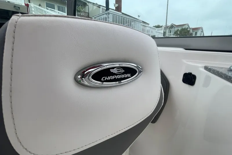 Slide: The Image of Chaparral 224 Sunesta 2014 boat interior with logo on white upholstery. - 25