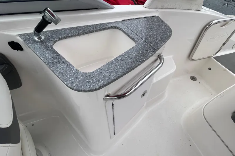 Slide: The Image of 2014 Chaparral 224 Sunesta boat interior with sink and countertop. - 30