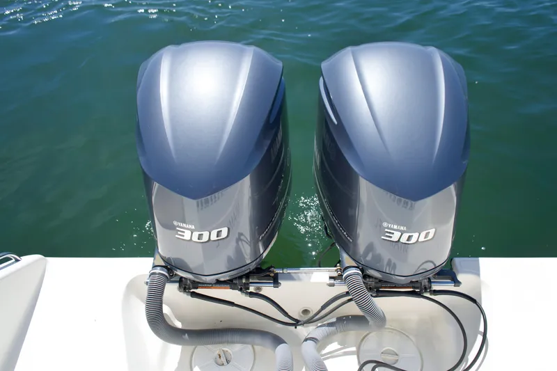 Slide: The Image of Two Yamaha 300 outboard motors on Pursuit ST 310 Sport boat. - 16
