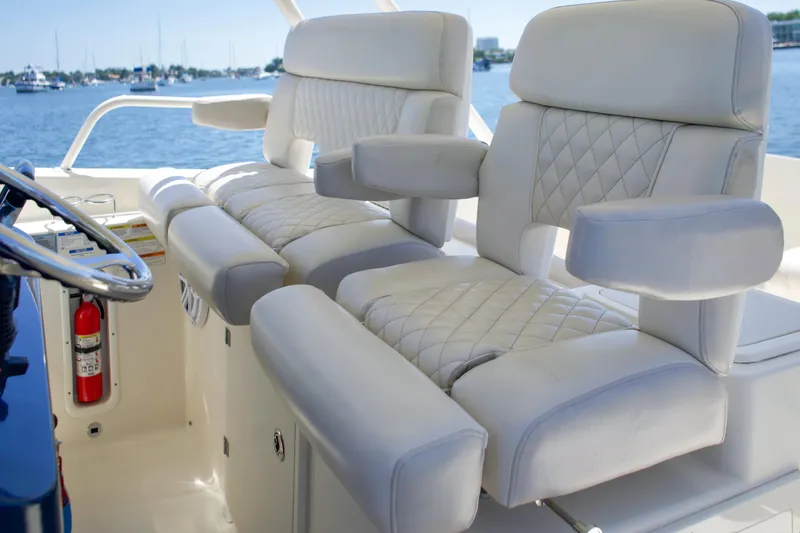 Slide: The Image of Luxurious seating on Pursuit ST 310 Sport boat, 2014 model. - 9