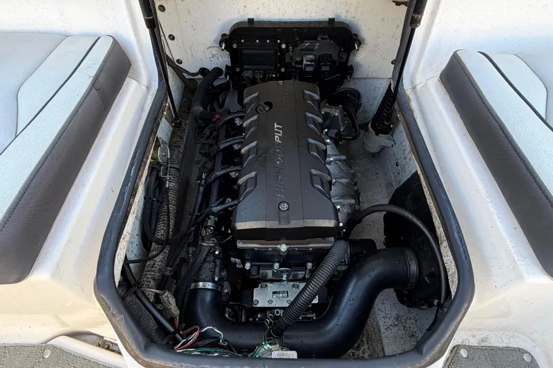Slide: The Image of Engine compartment of a 2019 Yamaha Boats SX190, showcasing the internal mechanics. - 10