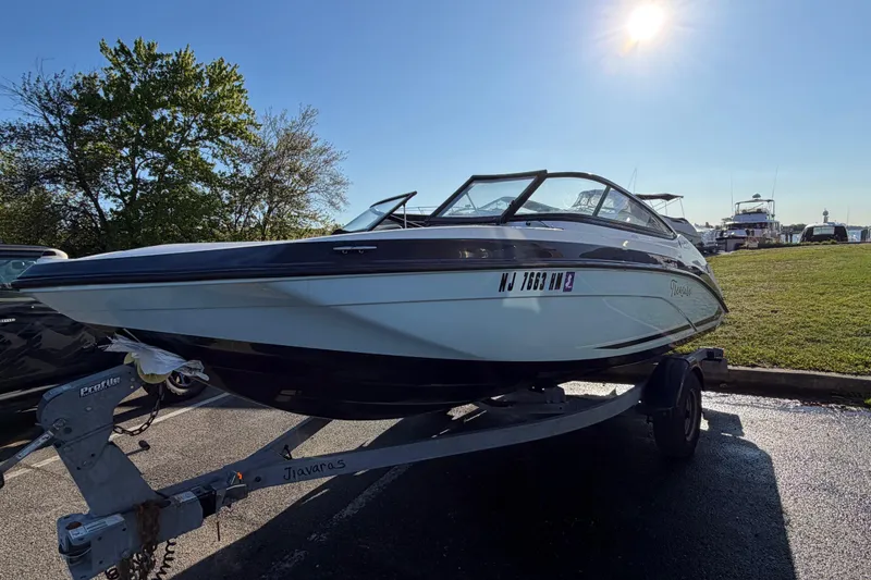 Slide: The Image of 2019 Yamaha Boats SX190 on trailer in sunny outdoor setting. - 3