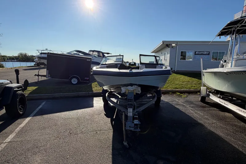 Slide: The Image of 2019 Yamaha Boats SX190 on trailer in sunny marina parking lot. - 5