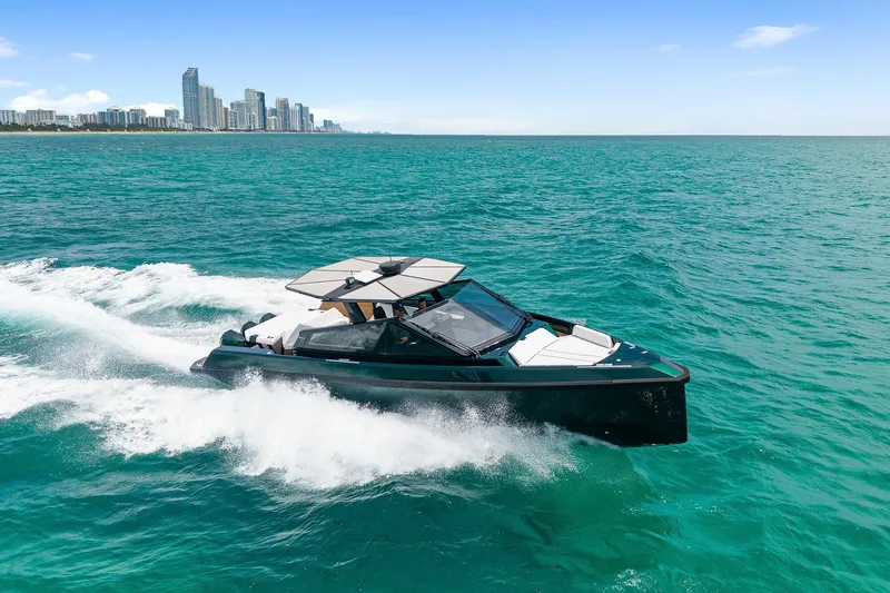 The Image of 2023 Wally wallytender43X yacht cruising on open sea near city skyline. - 0