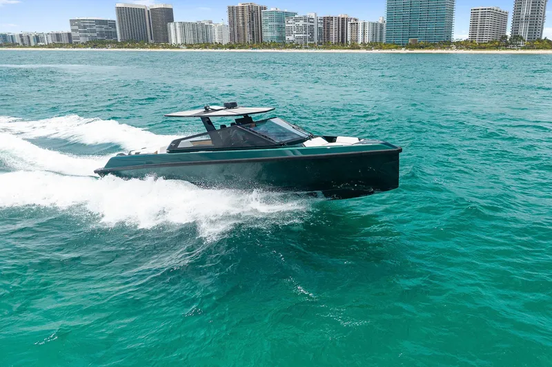 Slide: The Image of 2023 Wally wallytender43X yacht cruising on open sea near city skyline. - 10