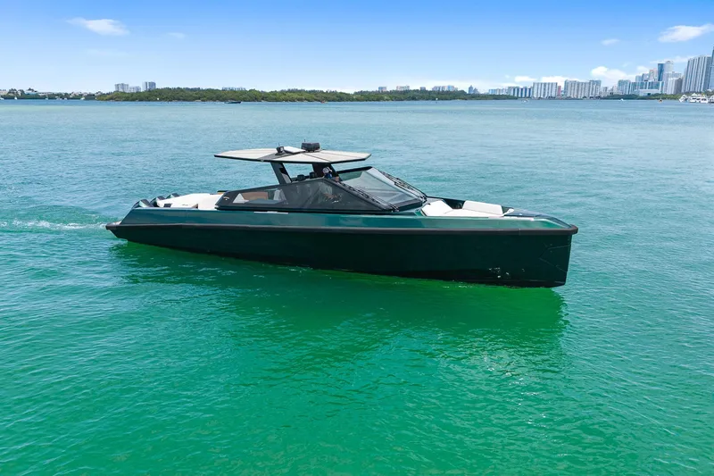 Slide: The Image of 2023 Wally wallytender43X on calm waters with city skyline. - 44