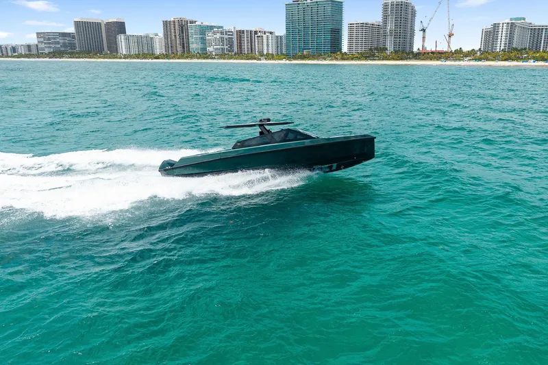 Slide: The Image of 2023 Wally wallytender43X yacht cruising on the sea near city skyline. - 8