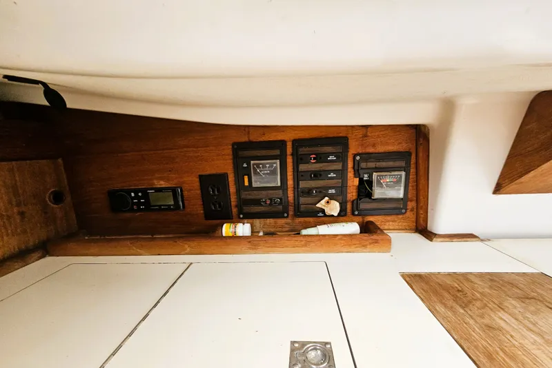 Slide: The Image of Interior view of a 1985 Sabre 34 with wood paneling and instrument panel. - 13