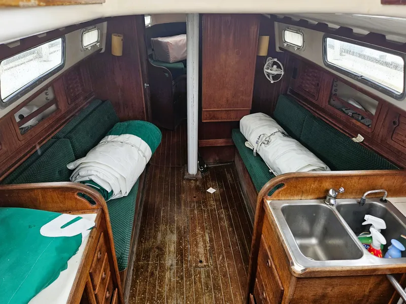 Slide: The Image of Interior of a 1985 Sabre 34 yacht with wooden furnishings. - 11