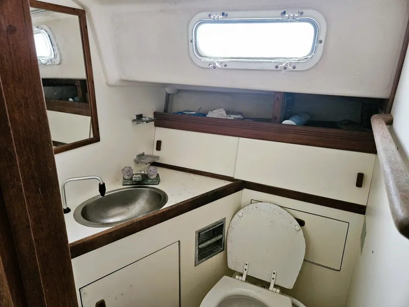 Slide: The Image of 1985 Sabre 34 yacht bathroom with sink and toilet. - 8