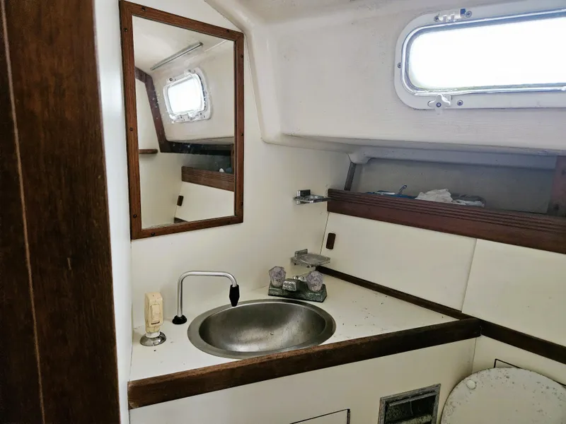 Slide: The Image of Interior of a 1985 Sabre 34 yacht with sink and mirror. - 9