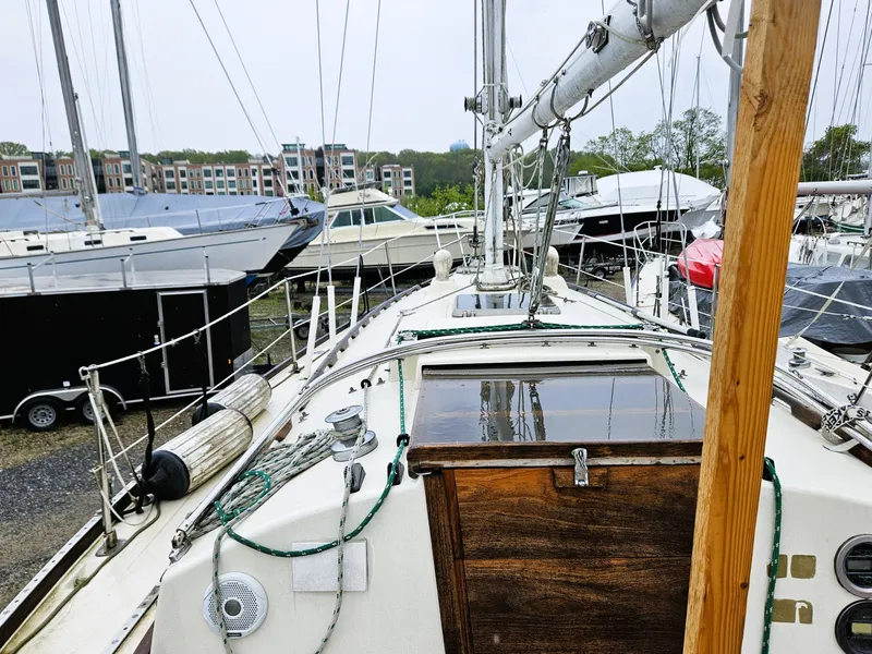 Slide: The Image of 1985 Sabre 34 sailboat docked among other yachts. - 3