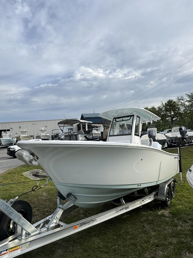 Slide: The Image of 2026 Sportsman Open 232 Center Console on trailer outdoors. - 10