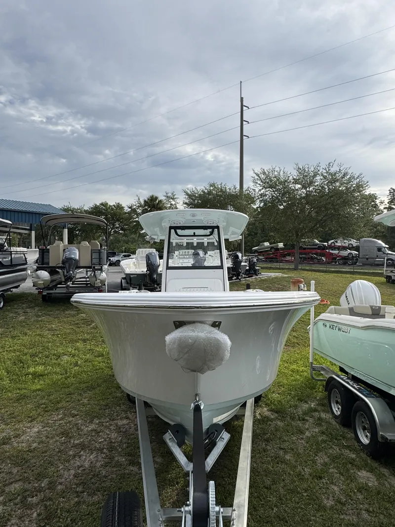 Slide: The Image of 2026 Sportsman Open 232 Center Console on trailer outdoors. - 12