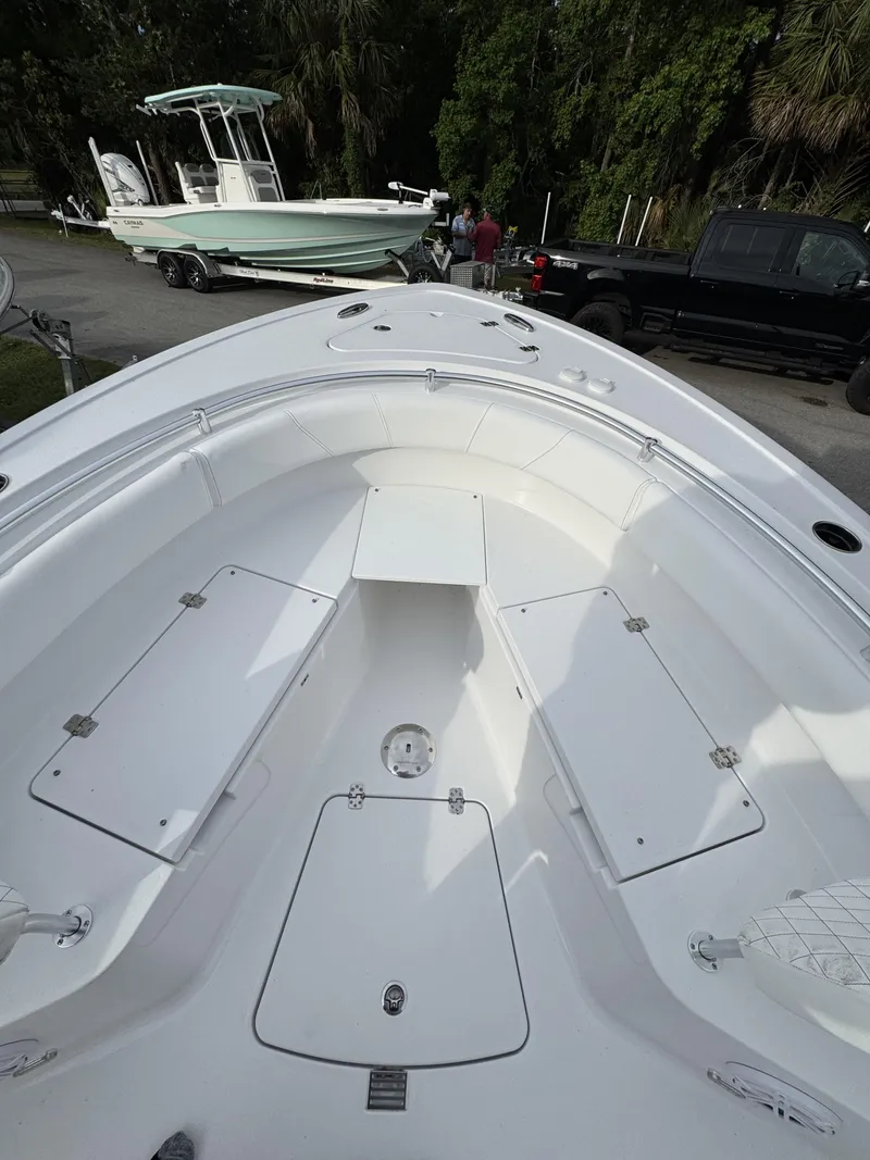 Slide: The Image of Sportsman Open 232 Center Console 2026 on trailer, front view. - 14