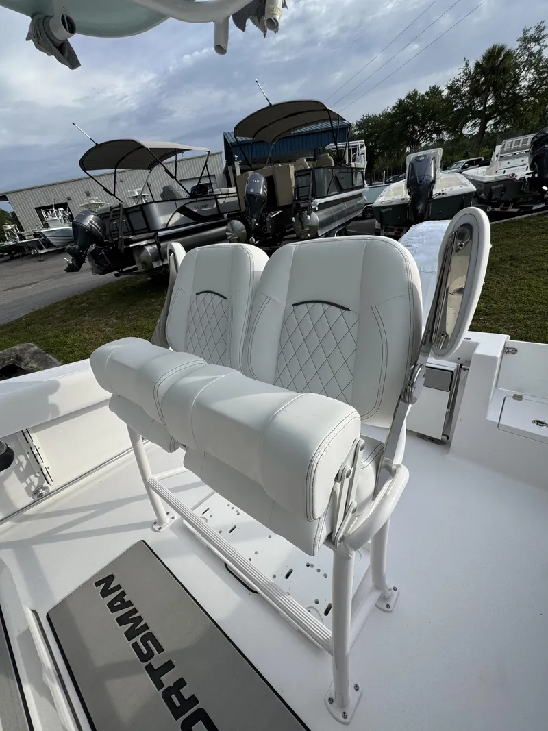 Slide: The Image of 2026 Sportsman Open 232 Center Console with luxurious white seating. - 17
