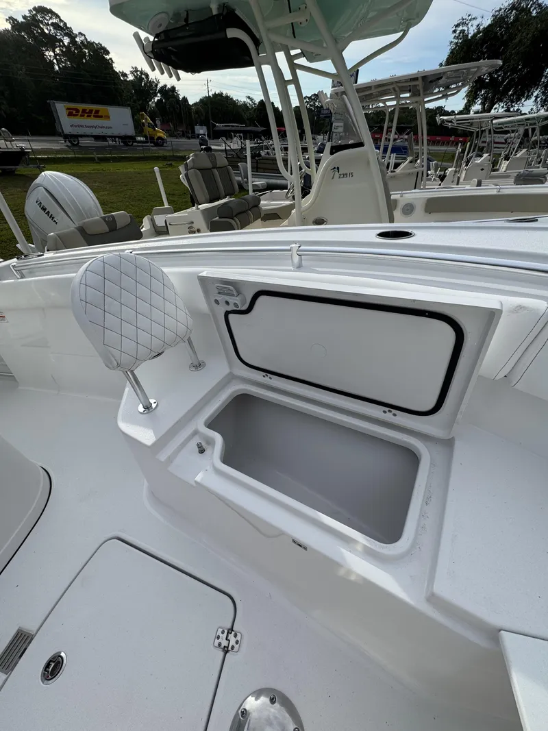 Slide: The Image of 2026 Sportsman Open 232 Center Console with open storage compartment. - 22