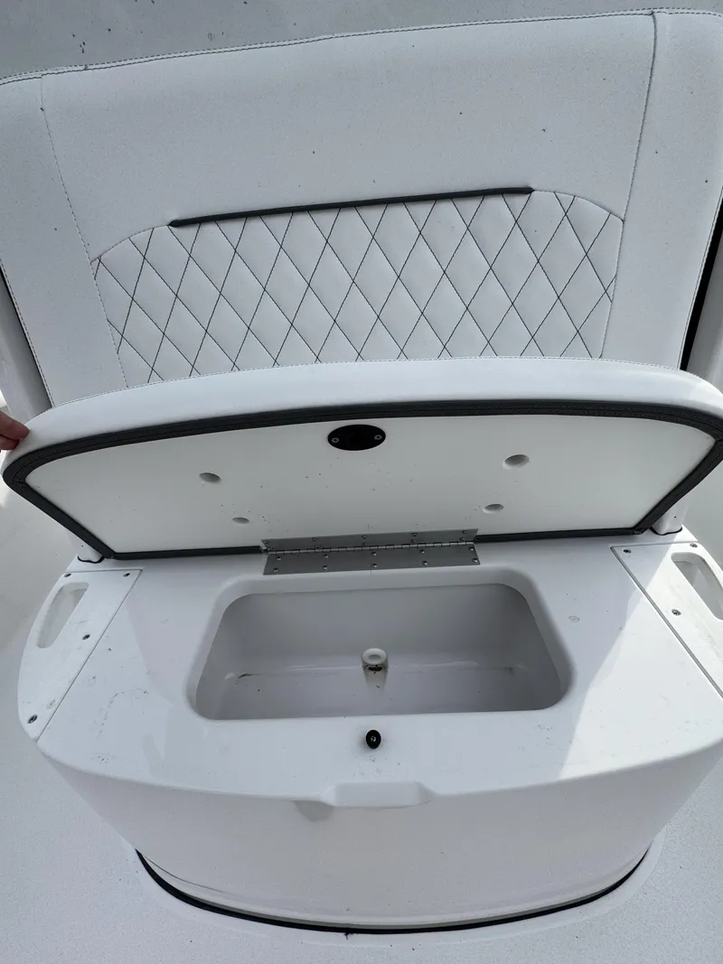 Slide: The Image of Sportsman Open 232 Center Console 2026 with open storage compartment. - 26