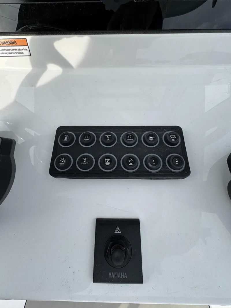 Slide: The Image of Control panel of Sportsman Open 232 Center Console 2026 with Yamaha control. - 27