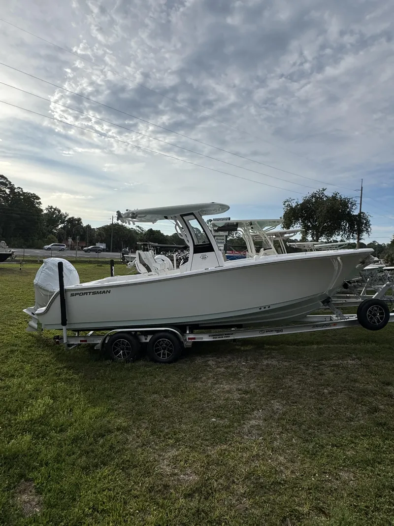 Slide: The Image of 2026 Sportsman Open 232 Center Console on trailer outdoors. - 3