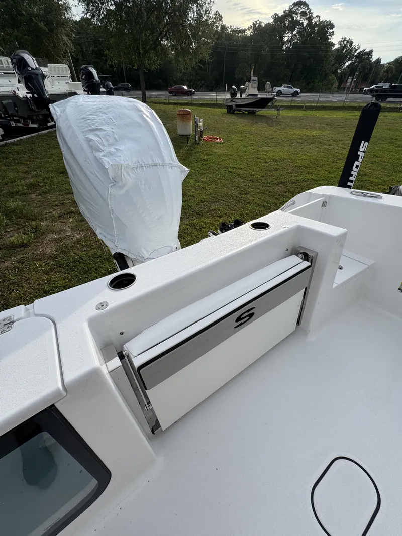 Slide: The Image of 2026 Sportsman Open 232 Center Console boat parked on grass. - 33