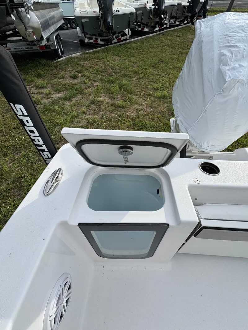 Slide: The Image of 2026 Sportsman Open 232 Center Console with open storage compartment. - 37