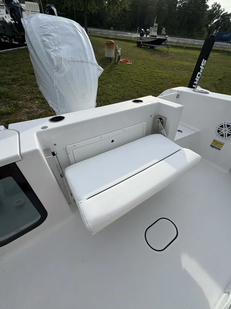 Slide: The Image of 2026 Sportsman Open 232 Center Console with white seat and cover. - 38