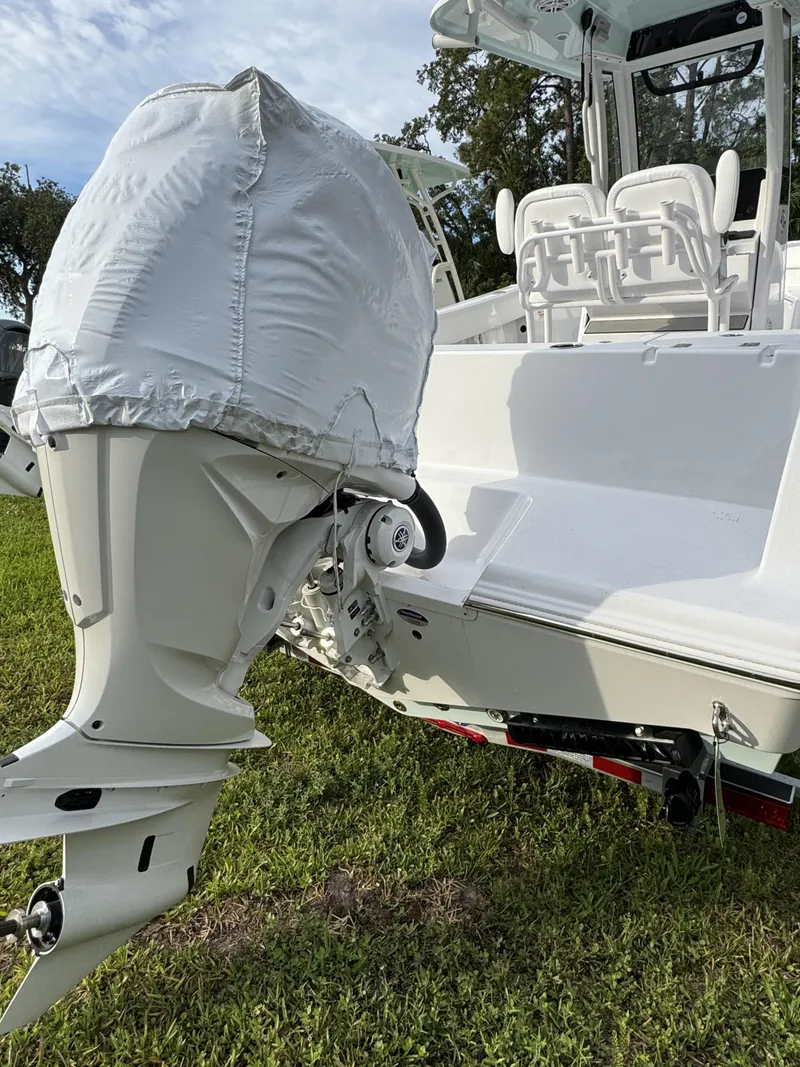 Slide: The Image of 2026 Sportsman Open 232 Center Console boat with engine cover. - 4