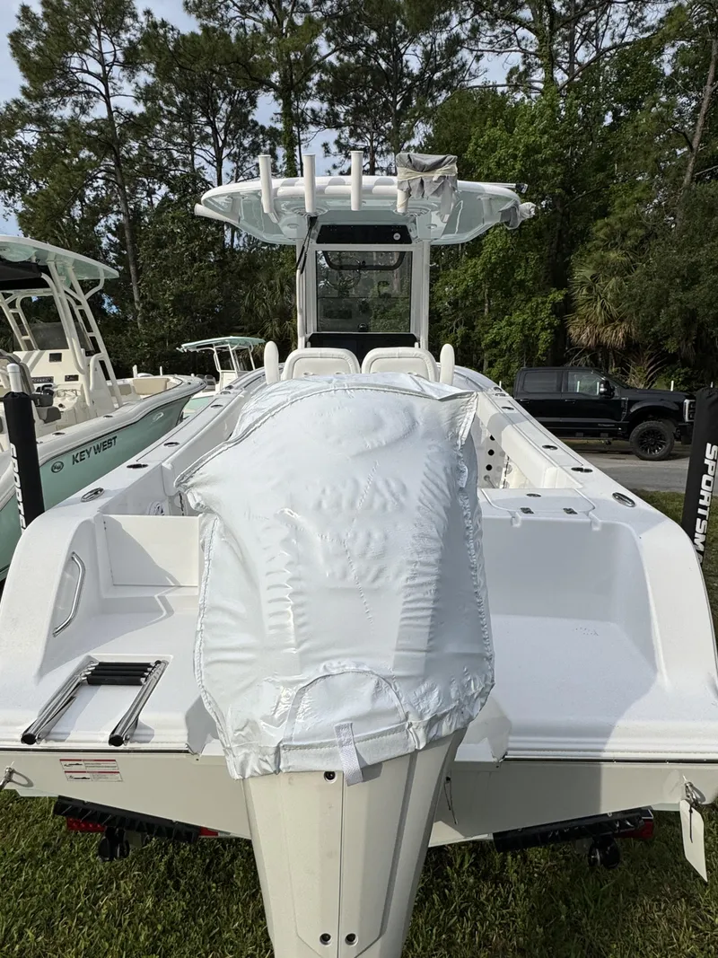 Slide: The Image of 2026 Sportsman Open 232 Center Console boat parked outdoors. - 6