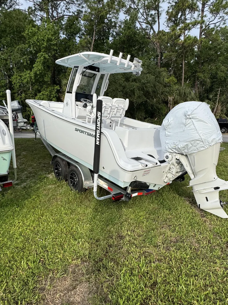 Slide: The Image of 2026 Sportsman Open 232 Center Console boat on trailer outdoors. - 8
