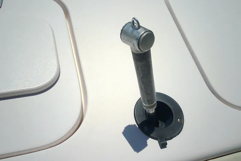Slide: The Image of Boat deck detail of a 2005 Grady-White Tournament 225, featuring a mounted rod holder. - 11