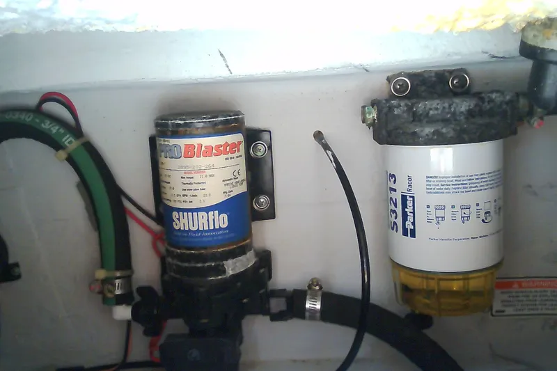 Slide: The Image of Boat engine compartment with SHURflo ProBlaster pump and Parker Racor filter, Grady-White Tournament 225, 2005. - 12