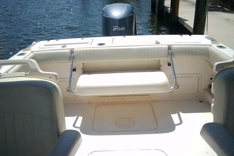 Slide: The Image of 2005 Grady-White Tournament 225 boat interior with seating and outboard motor. - 20