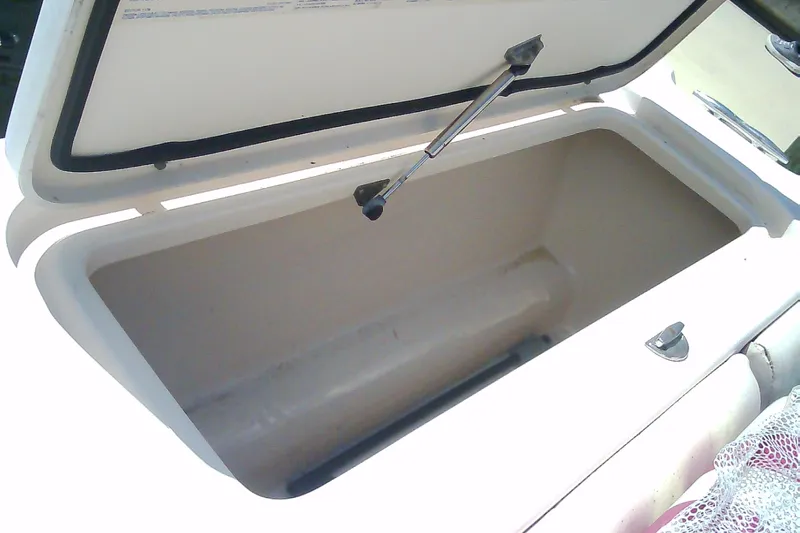 Slide: The Image of Open storage compartment on a 2005 Grady-White Tournament 225 boat. - 22