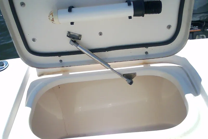 Slide: The Image of Open storage compartment on a 2005 Grady-White Tournament 225 boat. - 23