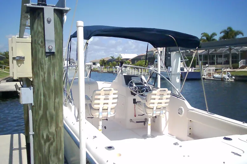 Slide: The Image of 2005 Grady-White Tournament 225 boat docked in sunny marina setting. - 31