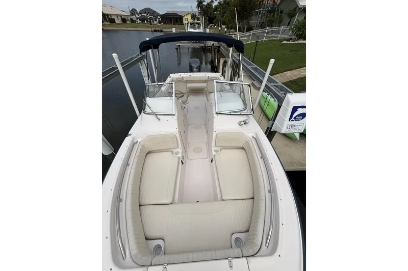 Slide: The Image of 2005 Grady-White Tournament 225 boat docked, featuring spacious seating and sleek design. - 4