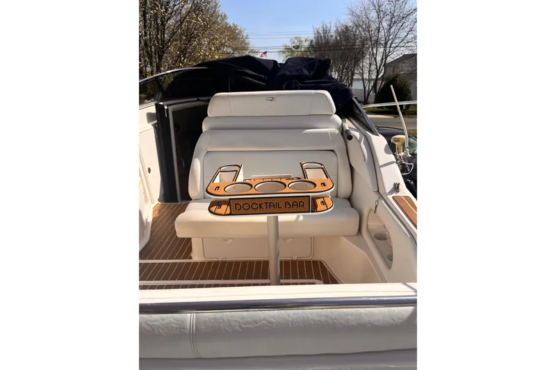 Slide: The Image of 2006 Regal Commodore 2665 boat interior with "Docktail Bar" setup. - 12