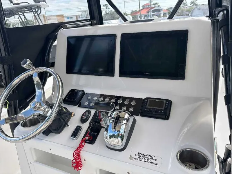 Slide: The Image of 2021 Blue Wave 2800 Makaira helm with screens and controls. - 19
