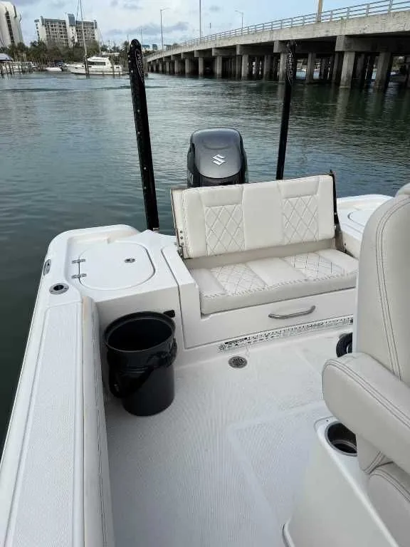 Slide: The Image of Interior of a 2021 Blue Wave 2800 Makaira boat by the water. - 8