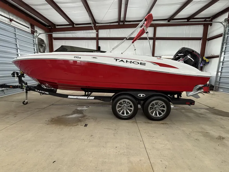 The Image of Red 2026 Tahoe S 210 S boat in warehouse. - 1