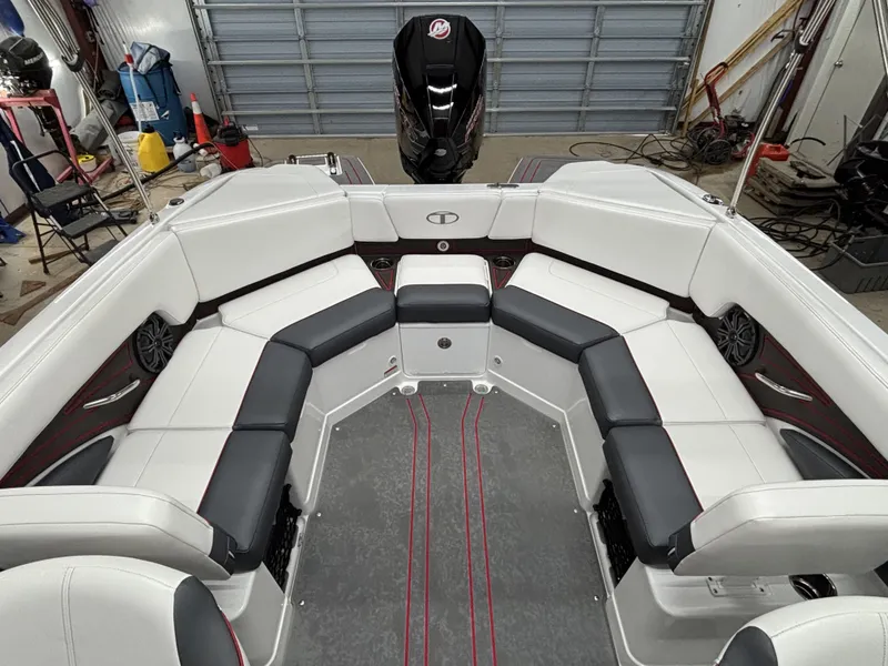 Slide: The Image of Interior of 2026 Tahoe S 210 S boat with white and black seating. - 11