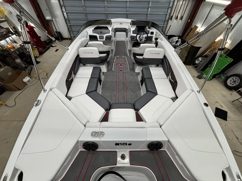 Slide: The Image of Interior view of 2026 Tahoe S 210 S boat in a garage. - 12