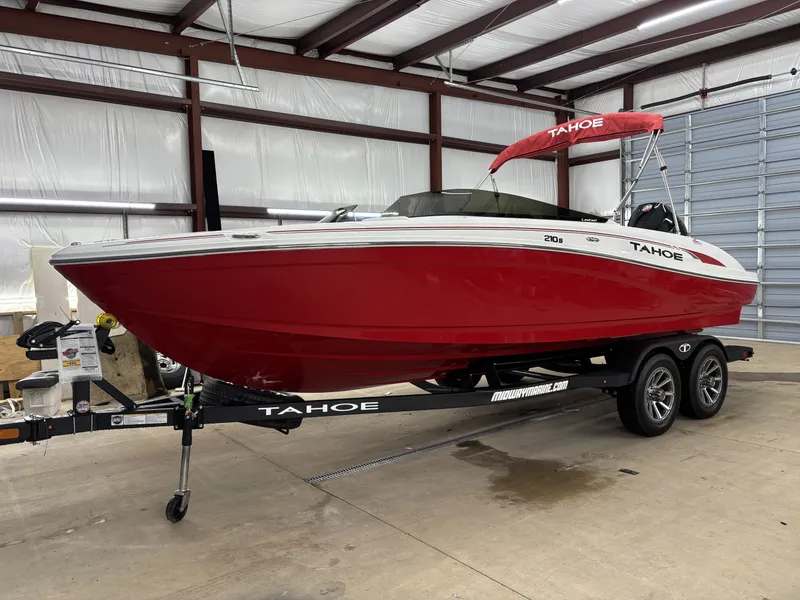 Slide: The Image of Red 2026 Tahoe S 210 S boat in warehouse on trailer. - 3