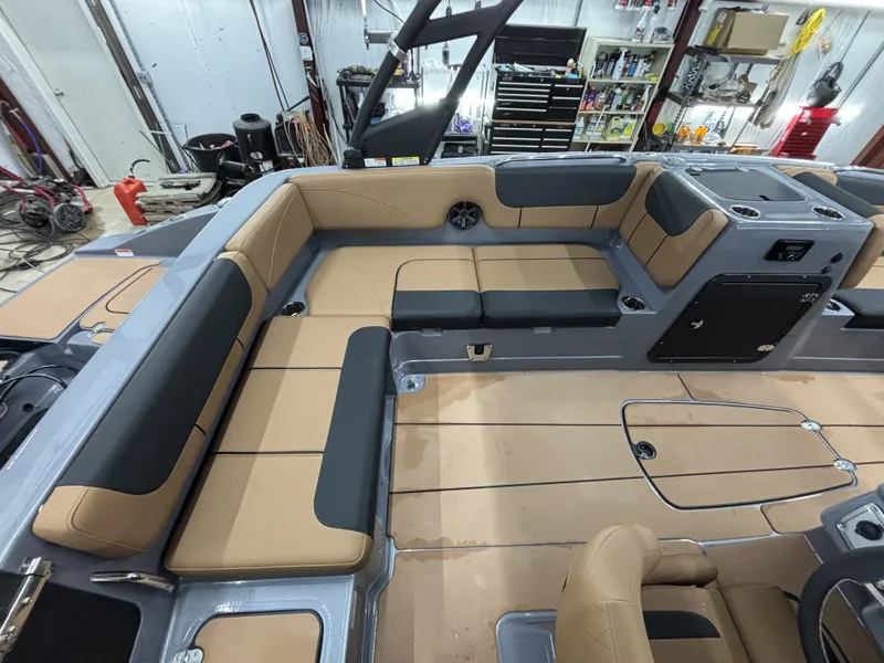 Slide: The Image of Interior of a 2026 Tahoe Deck 2150 boat with beige and gray seating. - 17