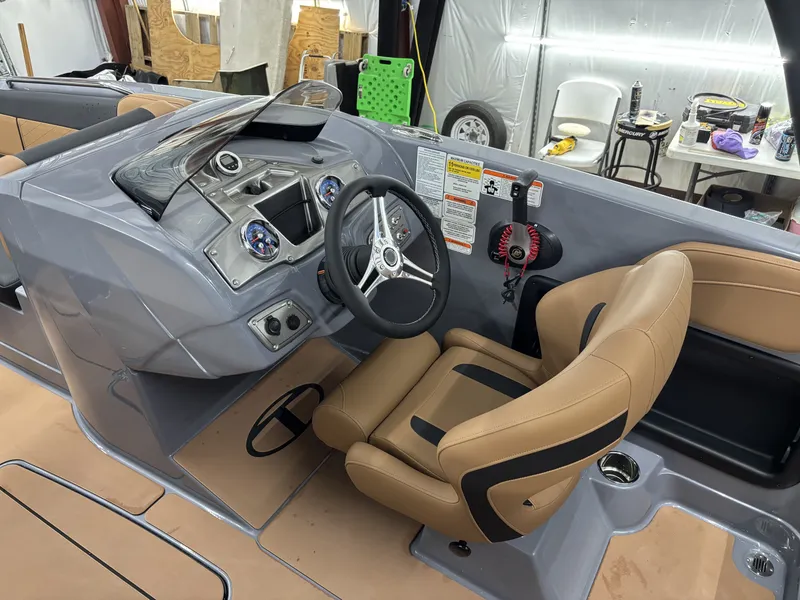 Slide: The Image of Interior of 2026 Tahoe Deck 2150 boat with steering console. - 19