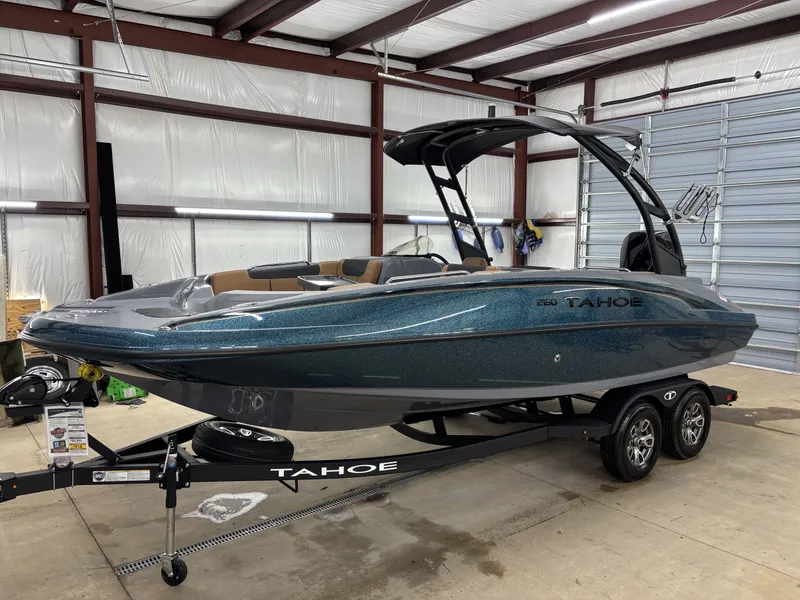 Slide: The Image of 2026 Tahoe Deck 2150 boat in warehouse on trailer. - 4